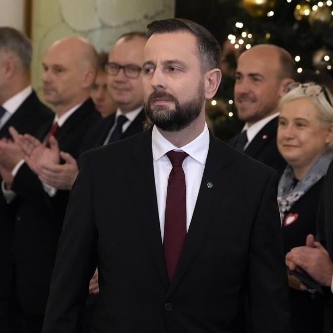 Polish defense minister fends off criticism after he says he keeps an emergency backpack ready